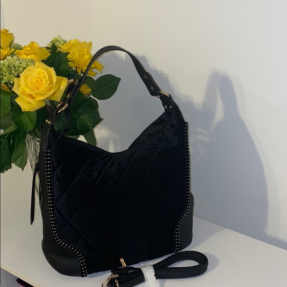 Handbags - Large suede shoulder bag with gold accents.